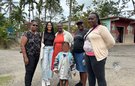 Azaria from CIUK with members of the community in Essex Hall, Kingston