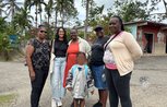 Azaria from CIUK with members of the community in Essex Hall, Kingston