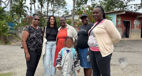 Azaria from CIUK with members of the community in Essex Hall, Kingston
