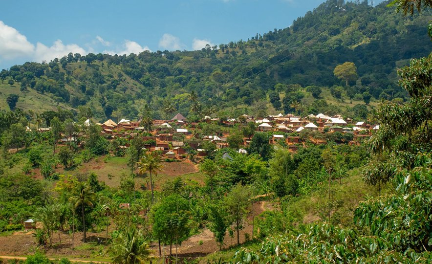 A mountainous landscape with a view of a small village