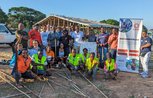CARE Shelter team in front of a project in Mozambique