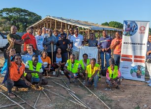 CARE Shelter team in front of a project in Mozambique