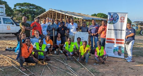 CARE Shelter team in front of a project in Mozambique
