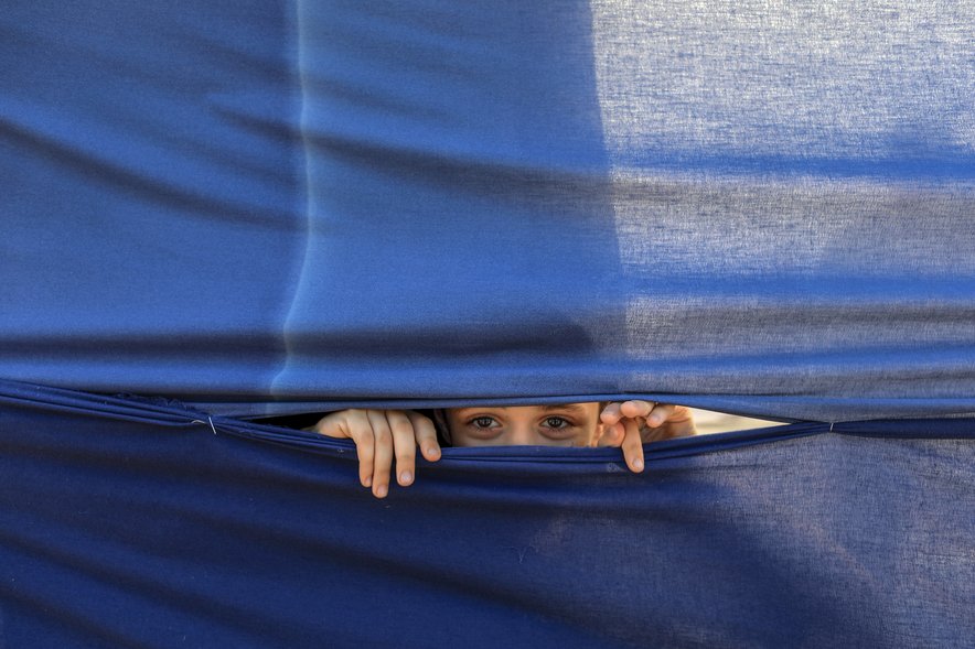 Gaza camp - child peering out
