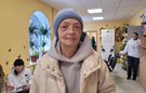 Olga standing in a community centre