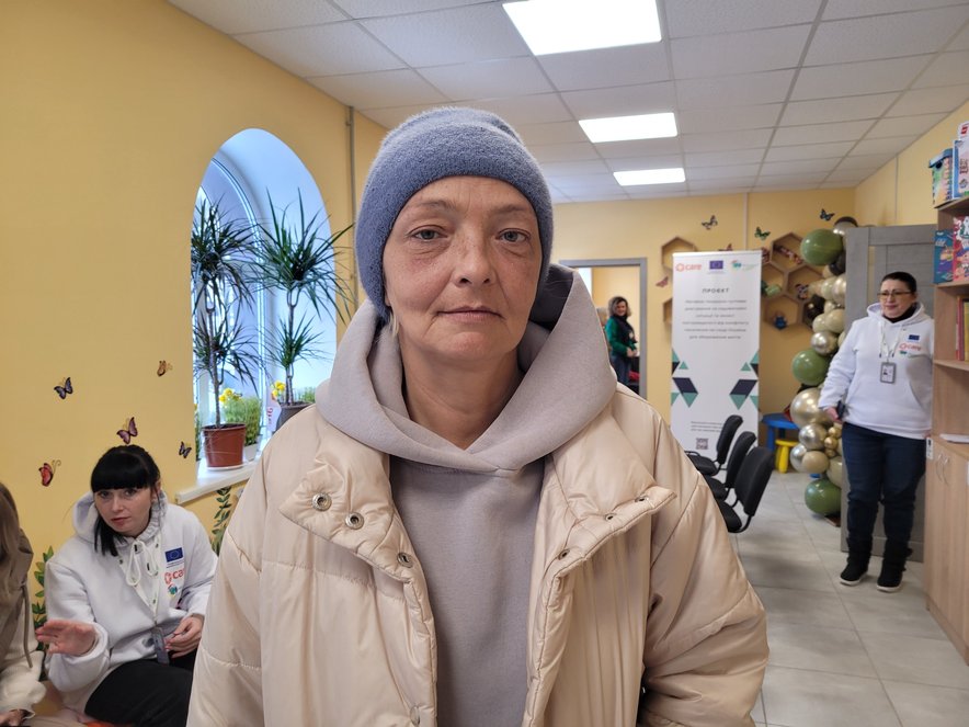 Olga standing in a community centre