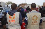 CARE and partner staff distribute water to people in displacement shelters in Rafah, Gaza