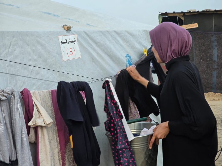 Yasmin hanging washing, Gaza