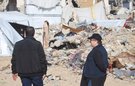 Jolien and an aid worker survey destroyed buildings in Gaza