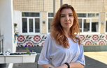 A woman stands in a school playground