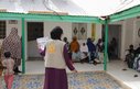 Women and children wait to be seen at a health facility in Somalia