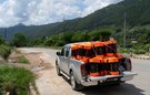 A truck on a remote road containing around 20 emergency CARE Packages
