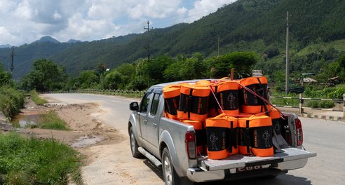 A truck on a remote road containing around 20 emergency CARE Packages