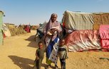 Khadra and her children at a displacement camp