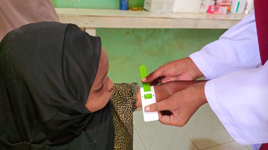 Khadra's daughter at a CARE health clinic