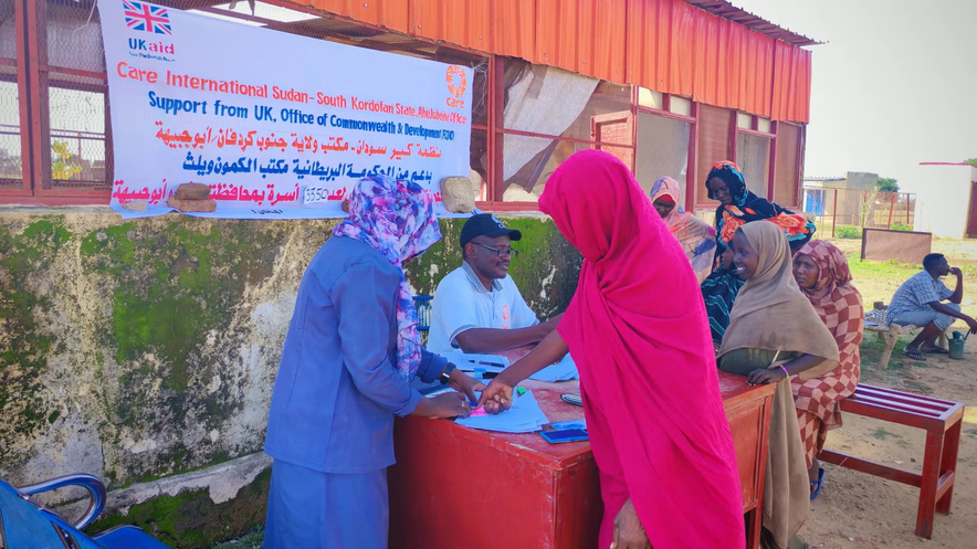 People queue for cash assistance South Kordofan, Sudan
