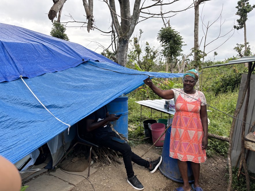 Carrol Clemming next to her tent in Westmoreland, Jamaica