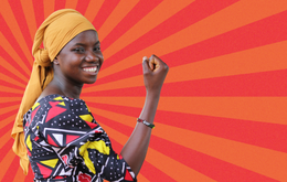 A woman holds her hand in a fist - there is a graphic background with orange and red stripes in kind of sunlight formation